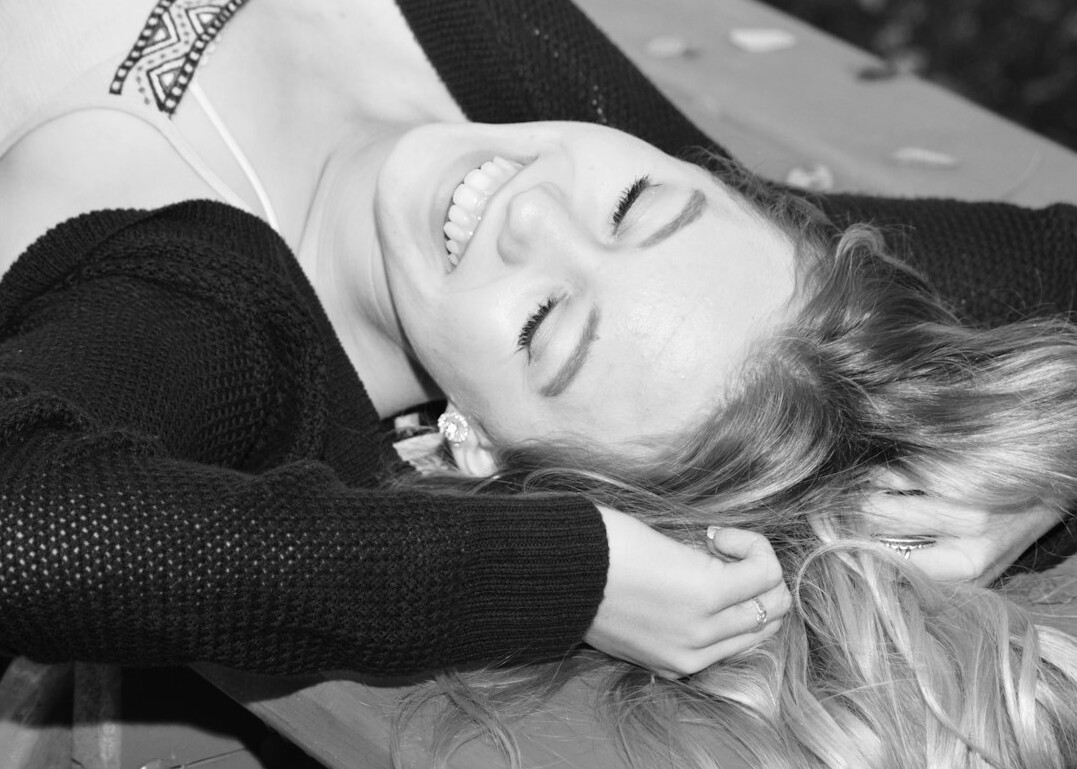 Smiling young woman with blonde hair